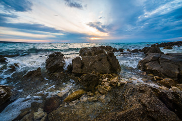 Fototapeta na wymiar sunset on croatian stony beach
