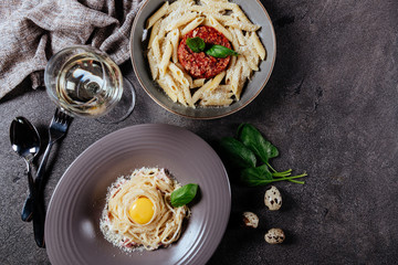 Italian style pasta dinner. Spaghetti with tomato and basil in plate , top view