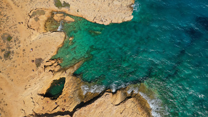 Aerial drone photo of famous devil's eye volcanic formation a natural swimming pool in Koufonisi island, Small Cyclades, Greece