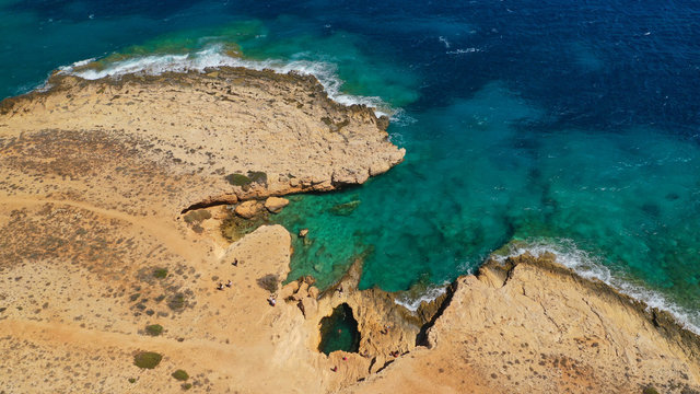 Aerial drone photo of famous devil's eye volcanic formation a natural swimming pool in Koufonisi island, Small Cyclades, Greece © aerial-drone
