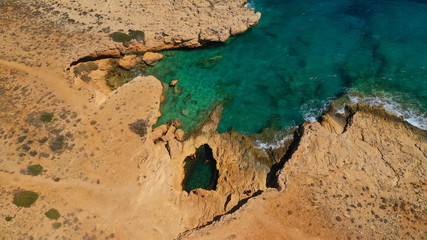 Aerial drone photo of famous devil's eye volcanic formation a natural swimming pool in Koufonisi island, Small Cyclades, Greece
