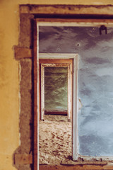 colourful old doors through an abandoned house 