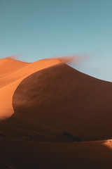 Fototapeta na wymiar Sand blowing off a Sand Dune in the Desert 