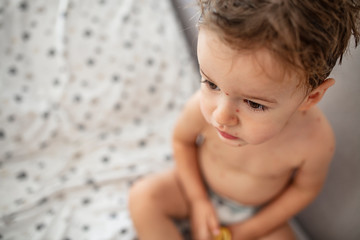 Child with spotted skin. Medical concept. Baby boy with mid-stage chicken pox. Young boy with...