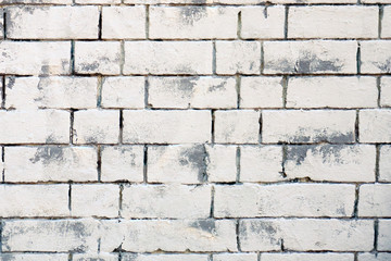 Background of retro brick wall. Texture of white brickwork. Bricks painted white and gray background.
