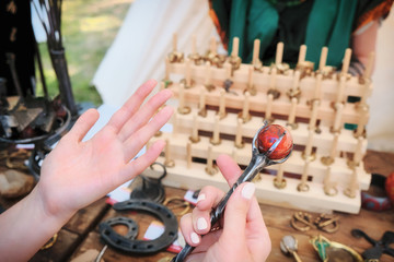 In women's hands a large hairpin in the form of a staff of Jasper. Fantasy hair pin with a big stone.