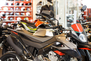 View of motorcycles parked in showroom for sale
