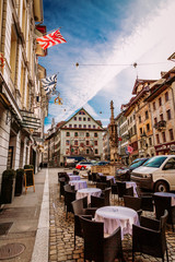 Old town street and restarurant tables in Lucerne city, Switzerland