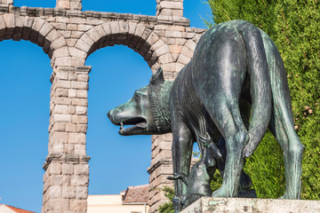 Lupa Capitolina statue at the foot of Aqueduct of Segovia on Plaza del Azoguejo, Unesco World Heritage Site, Spain