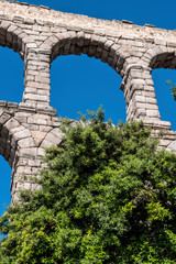Fototapeta na wymiar Partial view of the Roman aqueduct located in the city of Segovia, Unesco World Heritage Site, Spain