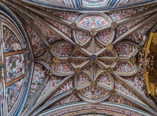 The gothic vault of Chapel Our Lady of Rosary in Cathedral of Our Lady of Assumption with the neoclassicistic frescoes, take in Segovia, Spain