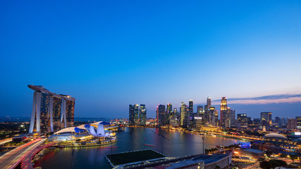Wide panorama of Singapore skyscrapers at dusk