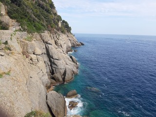 Portofino, Italy - 08/29/2019: Beautiful bay with colorful houses in Portofino in sumer days. Hiking around the ligurian mountains with amazing panoramic view.