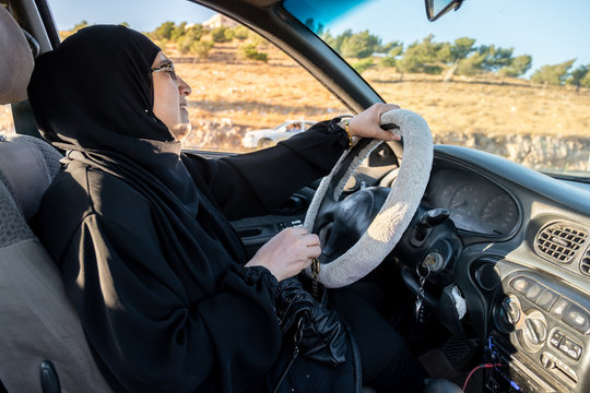 Arabic muslim woman driving