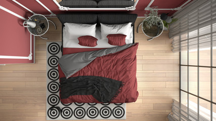 Modern red colored bedroom in classic room with wall moldings, parquet floor, double bed with duvet and pillows, bedside tables, mirror and decors. Interior design concept, top view