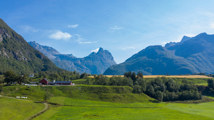 Fototapeta na wymiar Beautiful nature of Norway. A village on the fjord coast