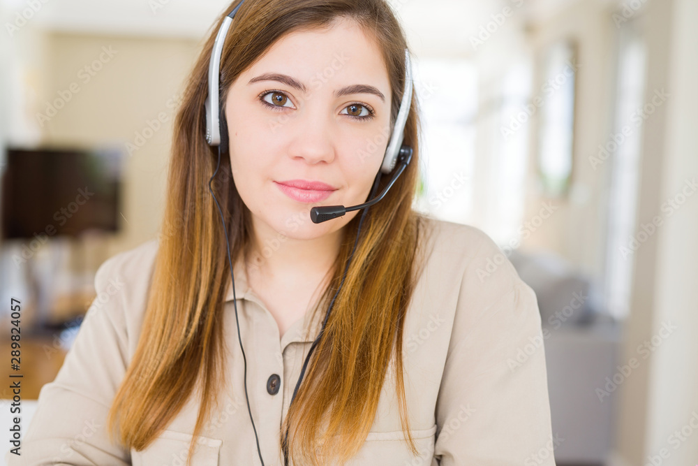 Canvas Prints Beautiful young operator woman wearing headset at the office Relaxed with serious expression on face. Simple and natural with crossed arms