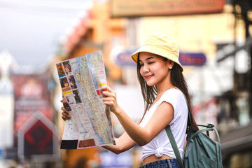 Asian woman with map at khaosan woad