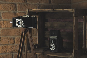 Vintage old manual film camera ,wooden table.Retro style