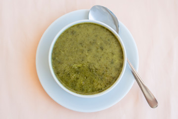 Green cream soup from spinach, close up