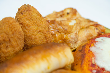 Sicilian Cartocciata, Pizzetta, Cipollina and Arancino. A typical street food from Sicily.