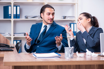Two employees suffering at workplace