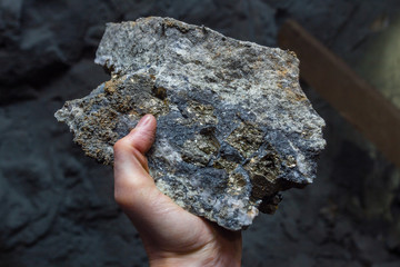 Gold ore pyrite galenite sample specimen in hand
