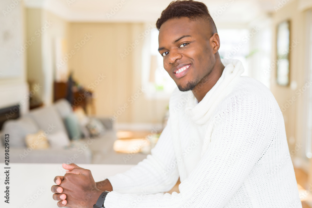 Sticker Handsome african young man smiling cheerful with a big smile on face