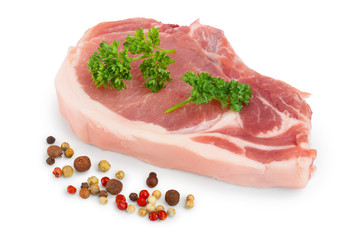 sliced raw pork meat with parsley and peppercorn isolated on white background