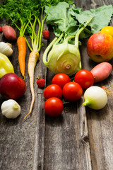 fresh fruits and vegetables on old weathered wooden