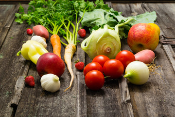 fresh fruits and vegetables on old weathered wooden