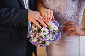 Obraz na płótnie Canvas Wedding rings on wedding day 