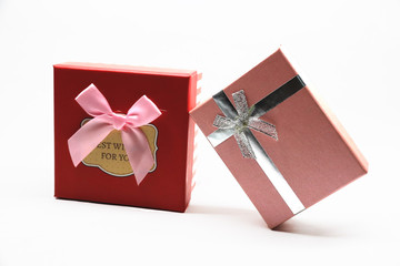 box with red bow isolated on white background