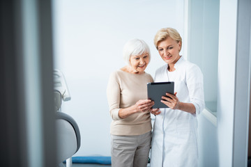 Adult woman and doctor in dental office