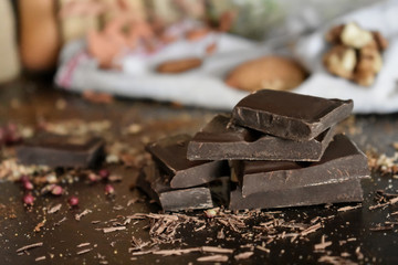 Chocolate tablet and chocolate shavings on the table