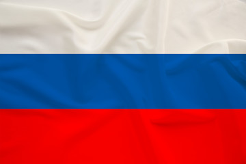 national flag of the country Russia on gentle silk with wind folds, travel concept, immigration, politics