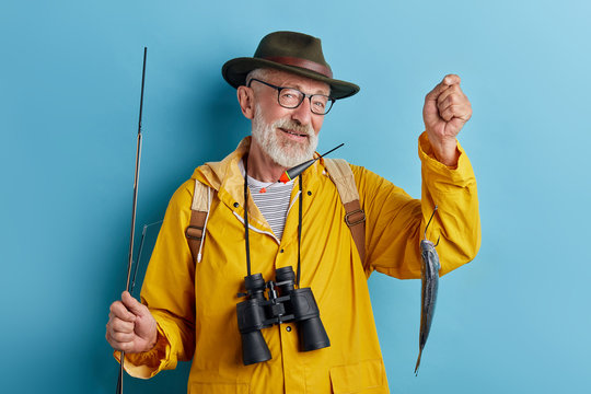 old man selling fish , close up photo, isolated blue background, successful deal, business