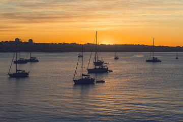 Yacht at sunrise in ocean bay. magical seascape