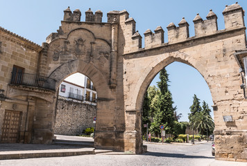 Fototapeta na wymiar Door of Jaen and Arch of the Villalar, he commemorates the victory in the Villalar battle, medieval walled city was a baeza, Andalusia, Spain
