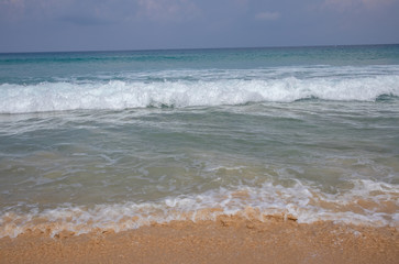 Fototapeta na wymiar Beautiful waves blue sea at Karon Beach Phuket