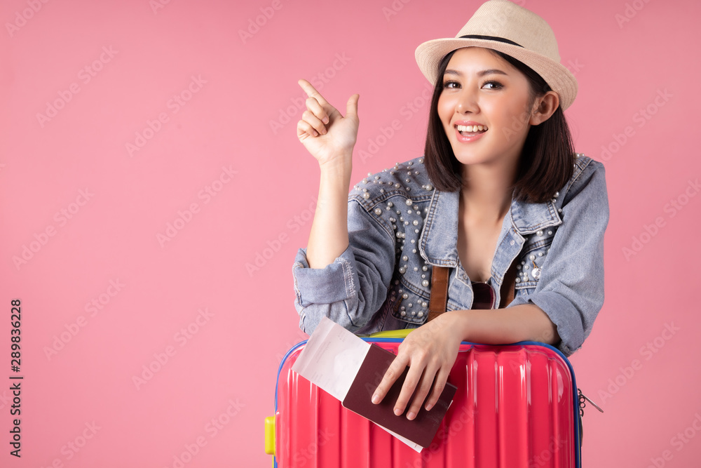 Wall mural tourist woman in summer casual clothes.asian smiling woman .passenger traveling abroad to travel on 