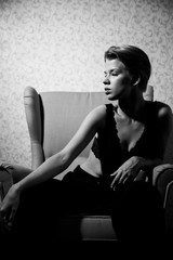 black and white photo model girl with a short haircut very beautiful, professionally posing, very tender