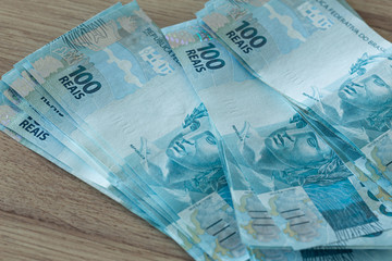 Brazilian money, 100 reais banknote on the table