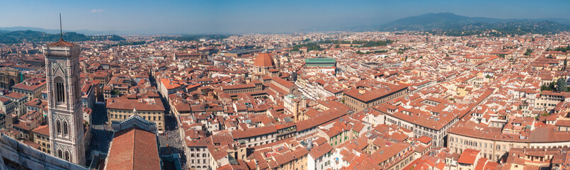 Fototapeta na wymiar Aerial cityscape of Florence with rooftops and view of Giotto Bell Tower