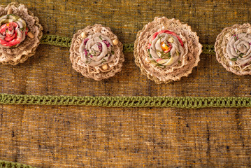 pink knitted brooches flowers in a row