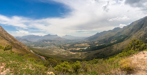 Epic mountain valley landscape with rural town