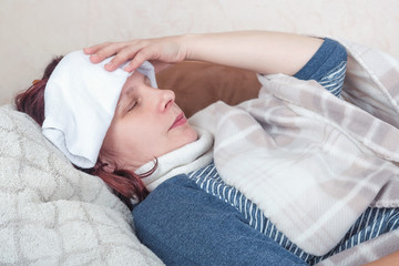 young woman blow one's nose