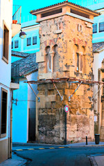 Bell along with ruins of a church in a spanish street