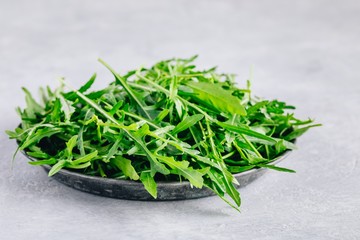 Fresh organic green leaves of arugula, ingredient for healthy salad