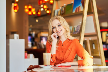 Designer with big blue eyes and blonde hair